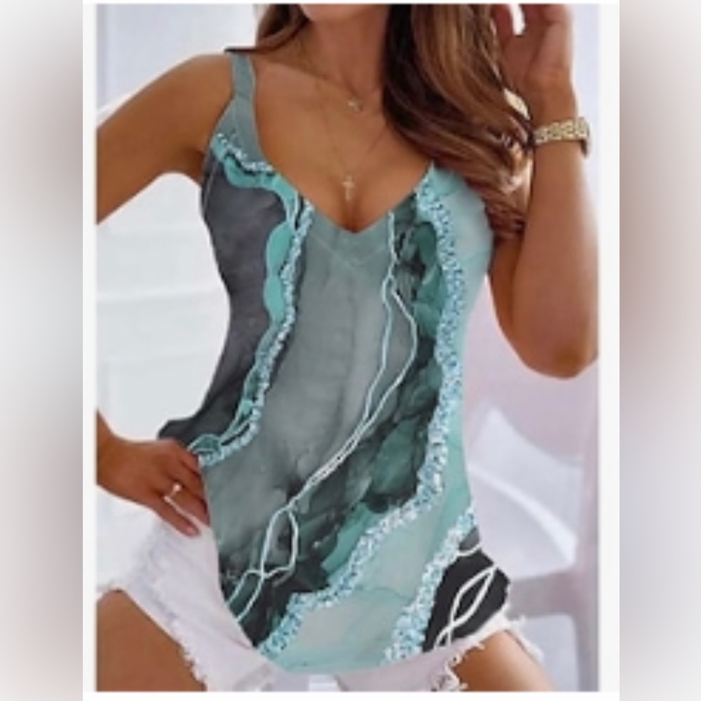 NWT WOMENS SZ 5 XL V
NECK TANK TOP STILL IN PACKAGE IDENTICAL TO TOP
PHOTO
